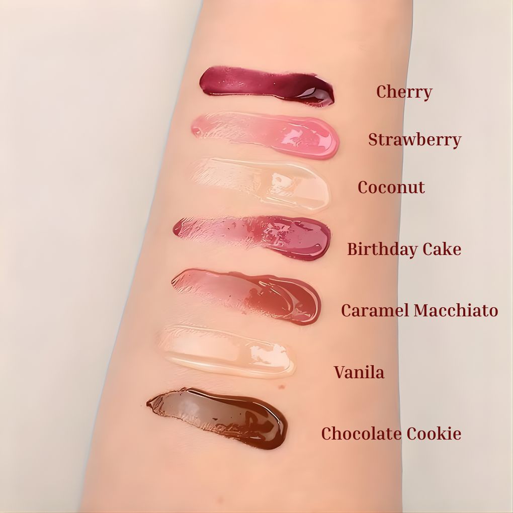 Oplenza Obsession Glass Lip Gloss full shade range.
Shades: Cherry, Strawberry, Coconut, Birthday Cake, Caramel Macchiato, Vanilla, Chocolate cookie.