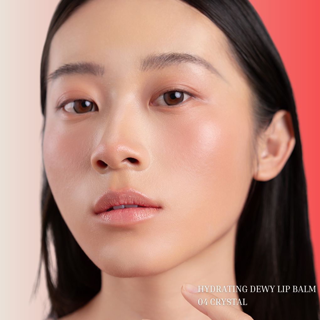 Model wearing Oplenza Hydrating Dewy Lip Balm in Shade 04 Crystal with glossy dewy finish.