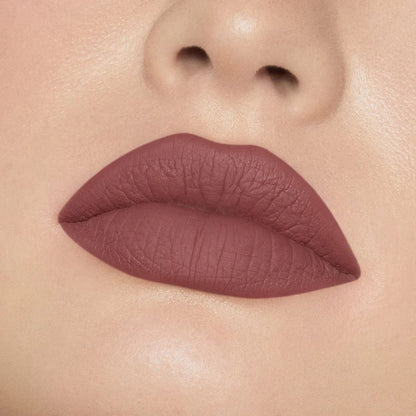 Close-up of model wearing oplenza Icon Matte Lipstick in shade 05 Cocoa Icon, best matte lipstick for dry lips.