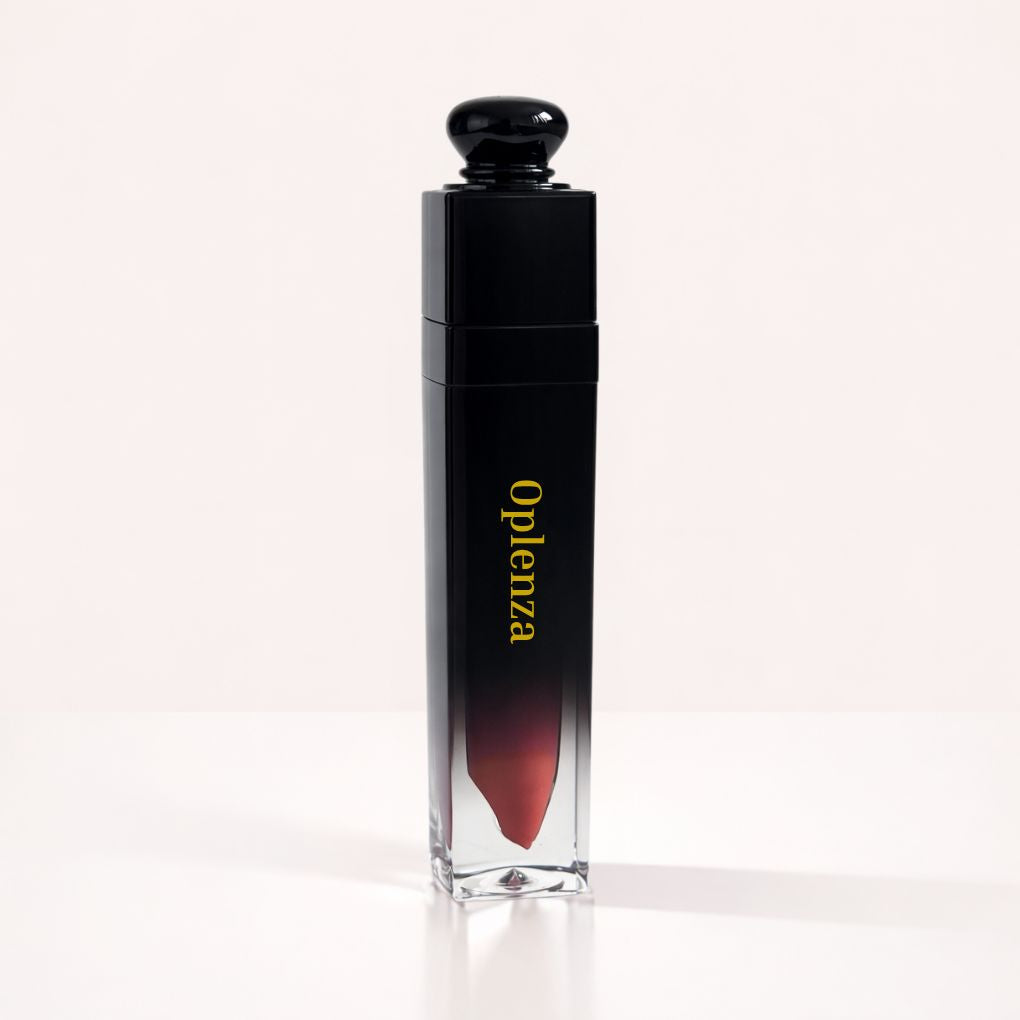 Oplenza Signature Ultra Shine Lip Gloss in 05 Cashmere, showing the tube on a neutral background, tinted lip gloss.
