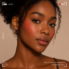Woman wearing and presenting oplenza Velvet Whip cream blush in shade 06 Apricot Melt