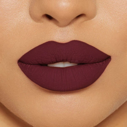 Close-up of model wearing oplenza Icon Matte Lipstick in shade 08 Wine Icon, best matte lipstick drugstore.