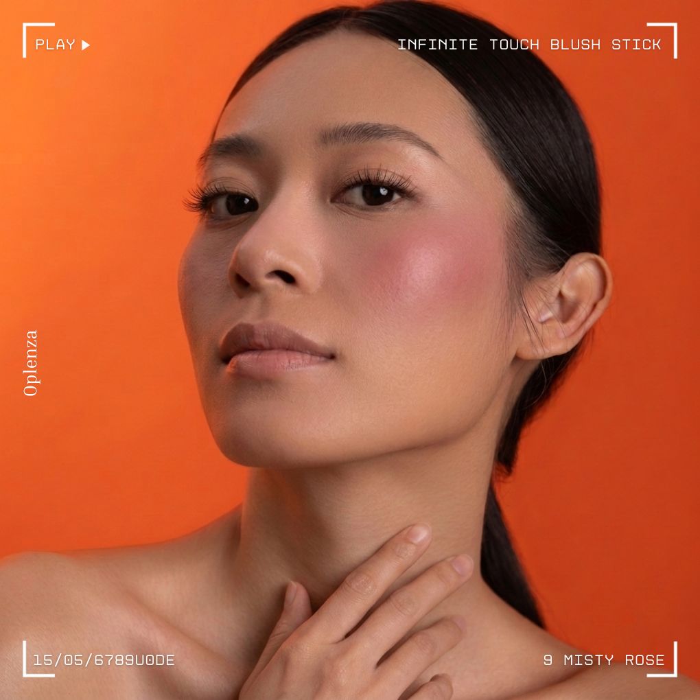 A woman showcasing and wearing on her cheek Oplenza highly pigmented, bold color Blush Stick-09 Misty Rose. Long-lasting radiant cream blush stick makeup product