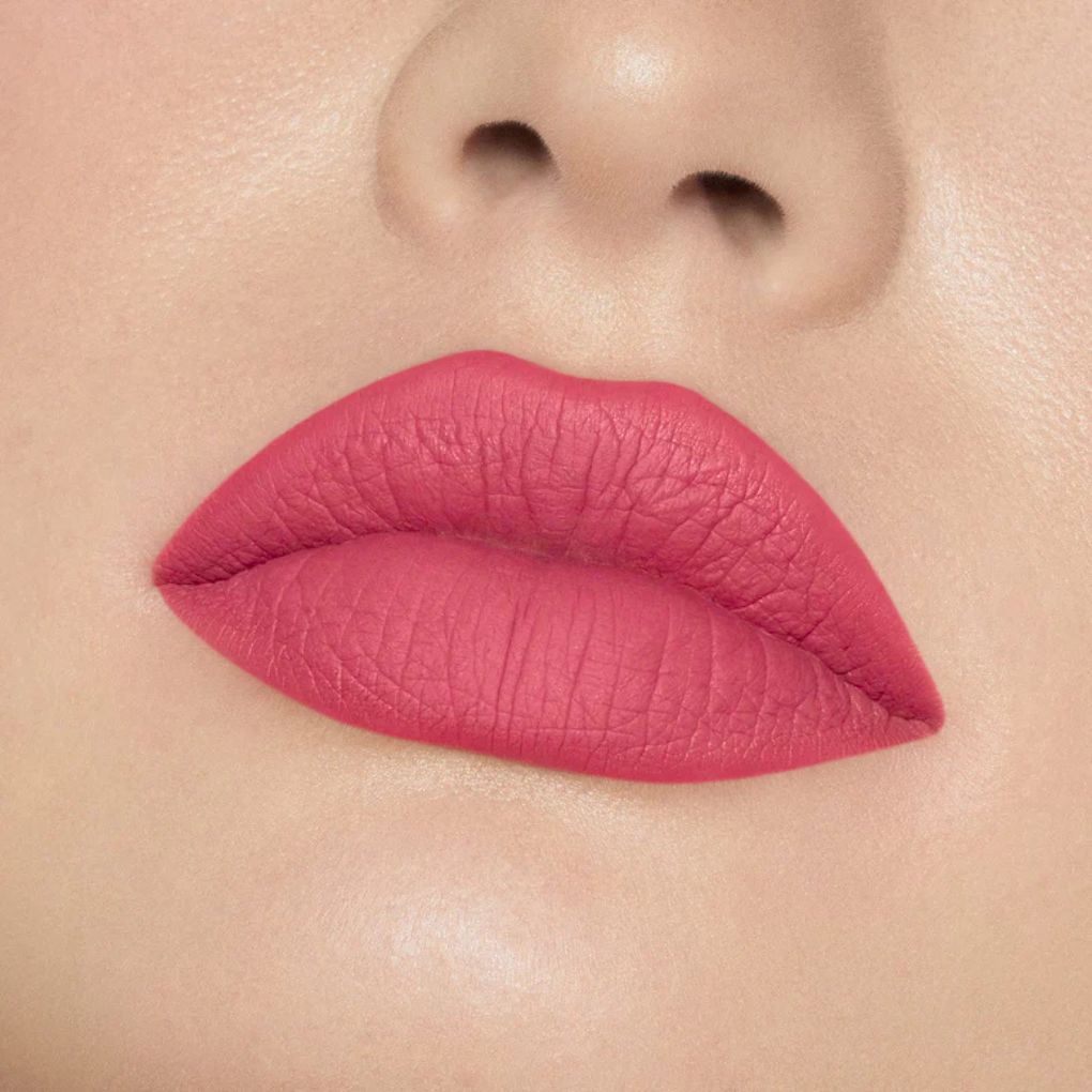 Close-up of model wearing oplenza Icon Matte Lipstick in shade 22 Rosy Icon, best matte lipstick for fair skin