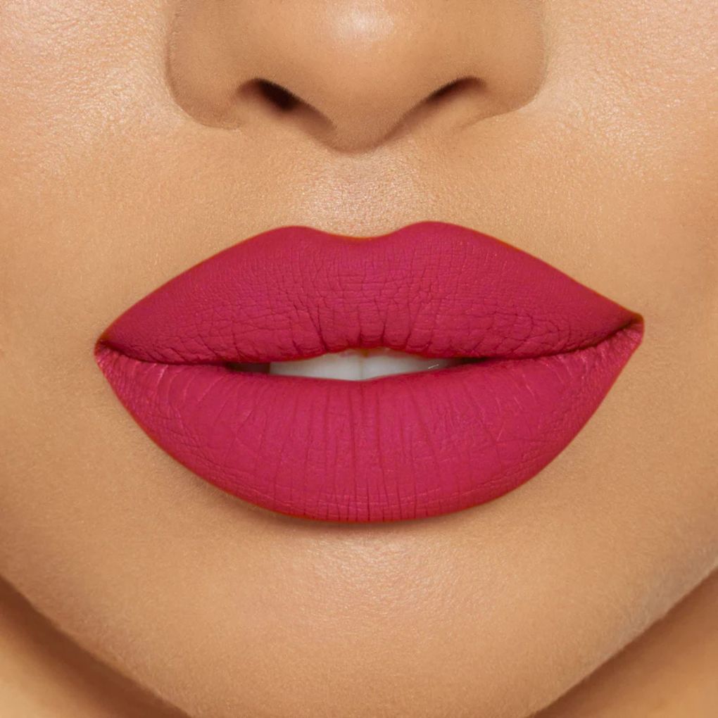 Close-up of model wearing oplenza Icon Matte Lipstick in shade 22 Rosy Icon, best matte lipstick for light brown Skin
