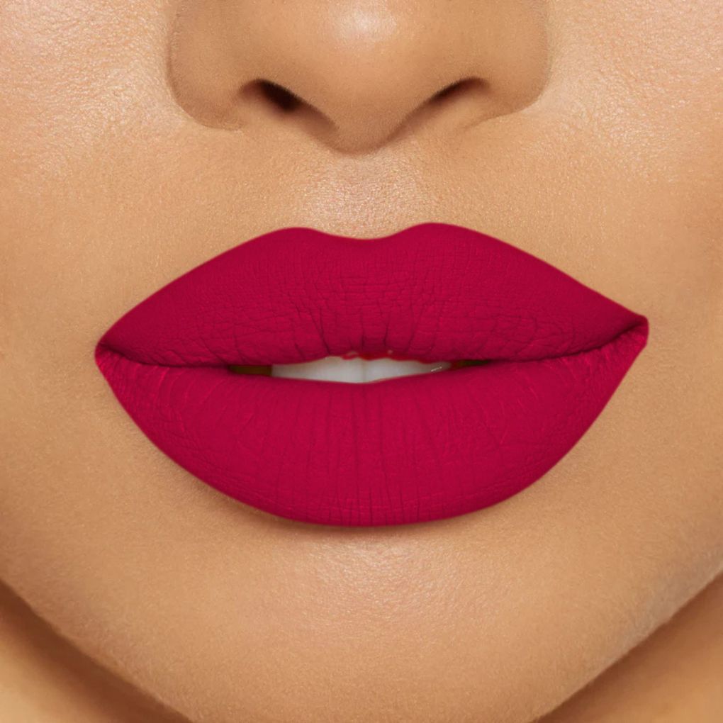 Close-up of model wearing oplenza Icon Matte Lipstick in shade 23 Ruby Icon, best matte lipstick that stays on