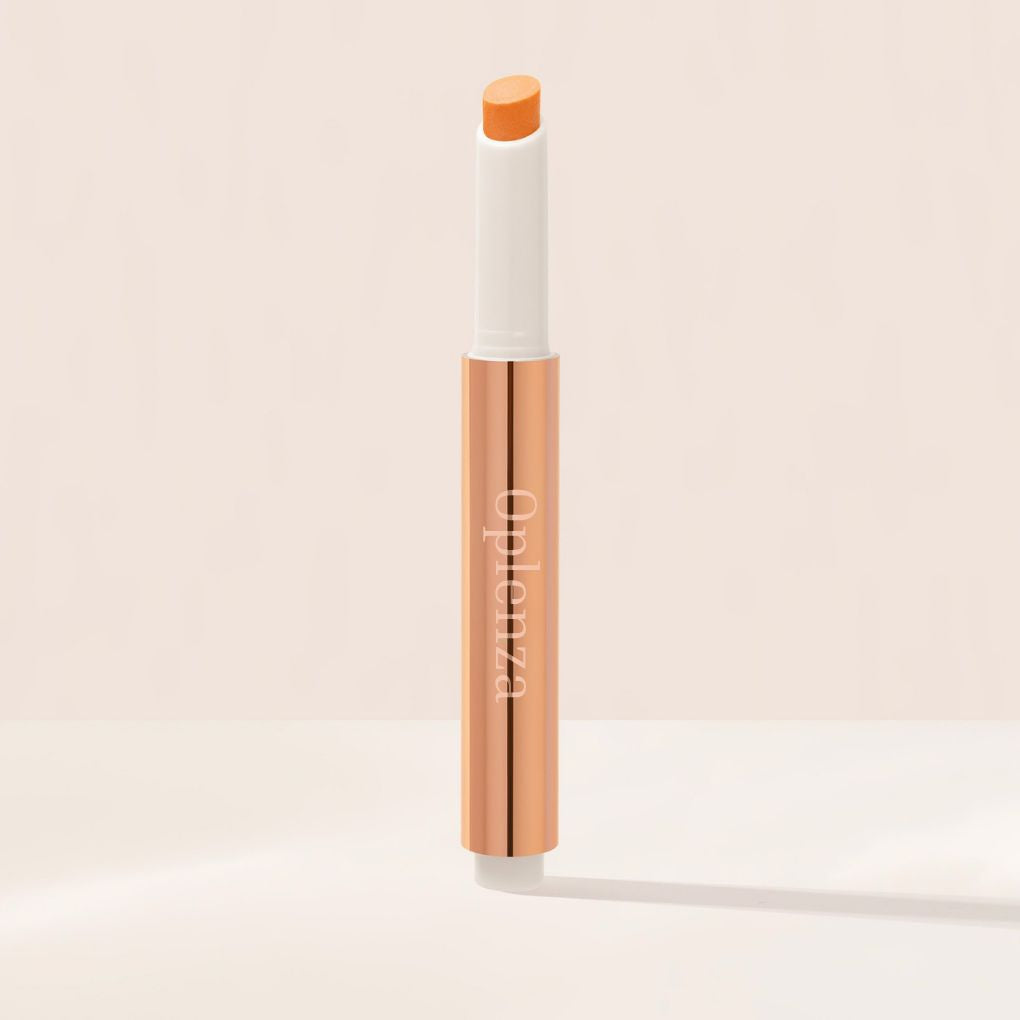 Oplenza Hydrating Shimmer Lip Balm in Afterglow, tinted moisturizing lip balm.