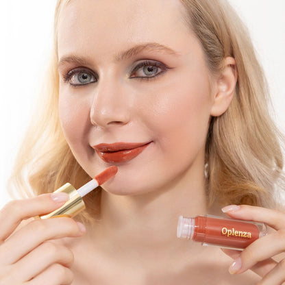 A woman wearing and showcasing the best cruelty-free, vegan, shiny and hydrating lip gloss in the Amber shade.