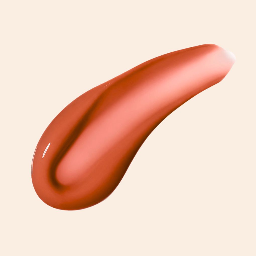 Oplenza Opulent Lustre Gloss Swatch - Amber, dewy glow, smudge-proof, clean beauty lip gloss for a radiant, long-lasting makeup look
