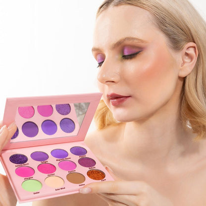 Woman holding and showcasing oplenza eyeshadow palette effect, radiant, colorful-shade Aurora Rush