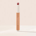 Oplenza Hydrating Shimmer Lip Balm in Bombshell, tinted moisturizing lip balm.
