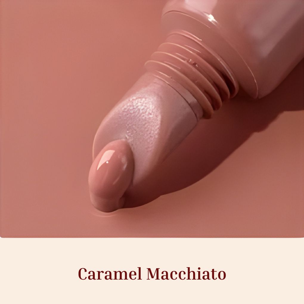 Oplenza Obsession Glass Lip Gloss applicator close-up, shade Caramel Macchiato