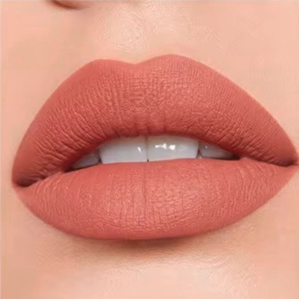Close-up lip swatch of Oplenza Matte-to-Shine Lip Duo in Cinnamon Oolong with a matte finish.