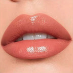 Close-up lip swatch of Oplenza Matte-to-Shine Lip Duo in Cinnamon Oolong with a glossy finish.