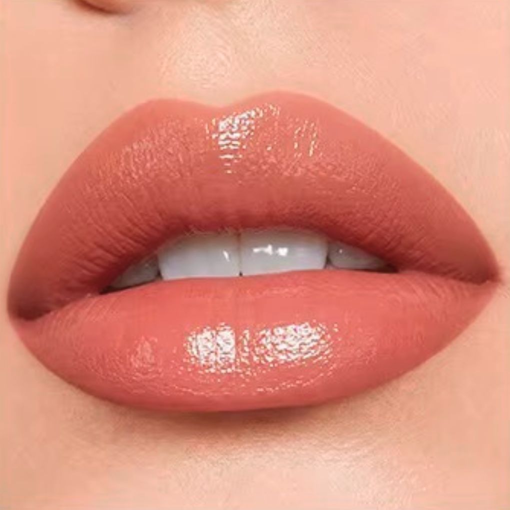 Close-up lip swatch of Oplenza Matte-to-Shine Lip Duo in Cinnamon Oolong with a glossy finish.