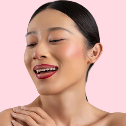 An elegant woman wearing the vegan, luxury and cruelty free oplenza Define & Refine Lip Liner in the color Crimson Velvet