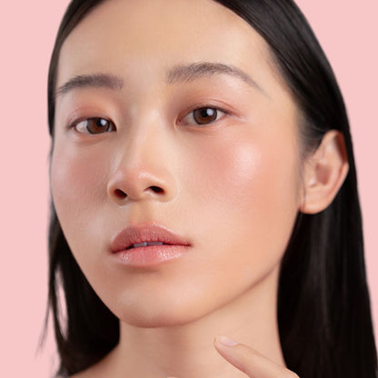 Woman wearing Oplenza Hydrating Dewy Lip Balm in shade Crystal, vegan hydrating lip care with natural glossy finish