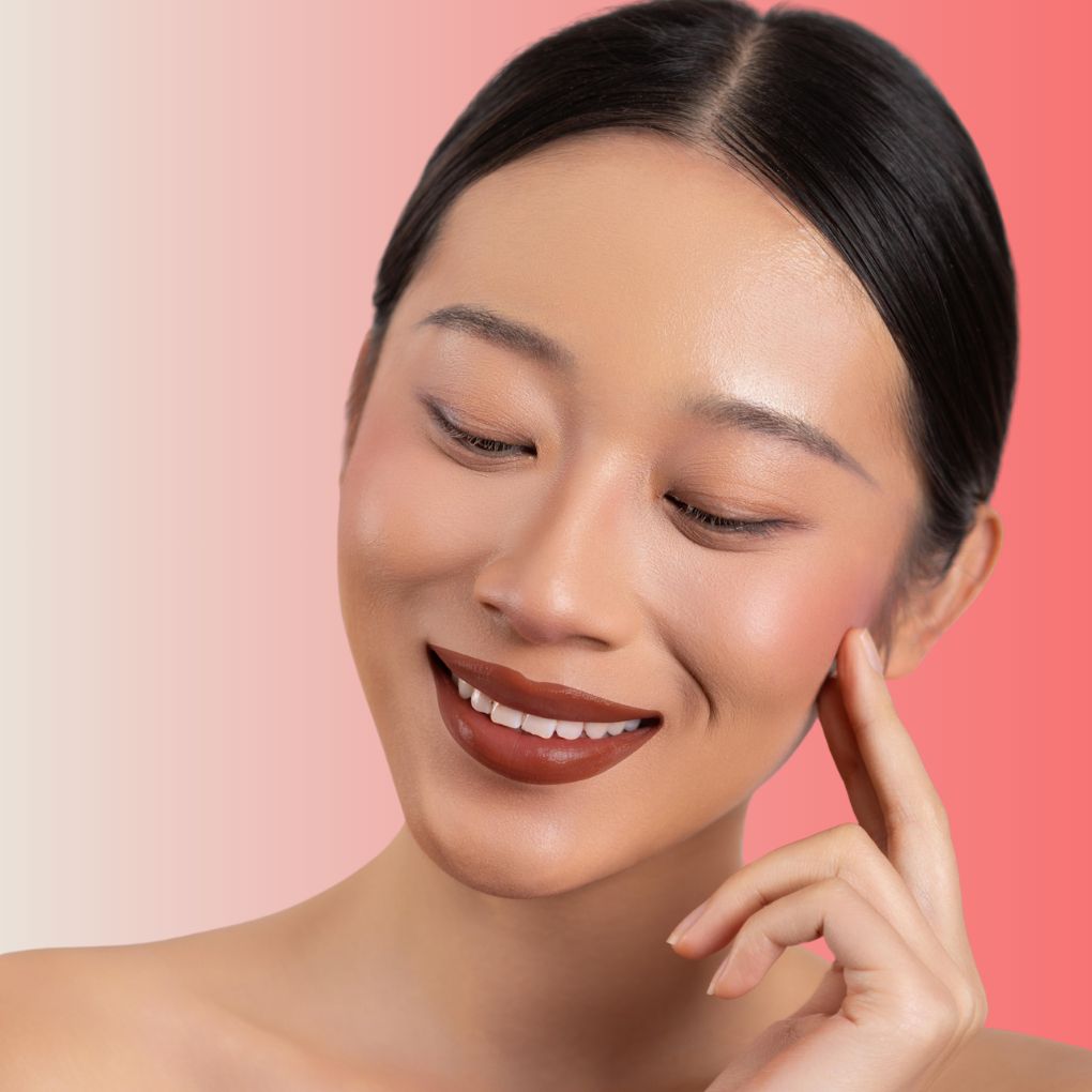 An elegant woman wearing and showcasing the vegan, luxury and cruelty free oplenza Define & Refine Lip Liner in the color Deep Bark