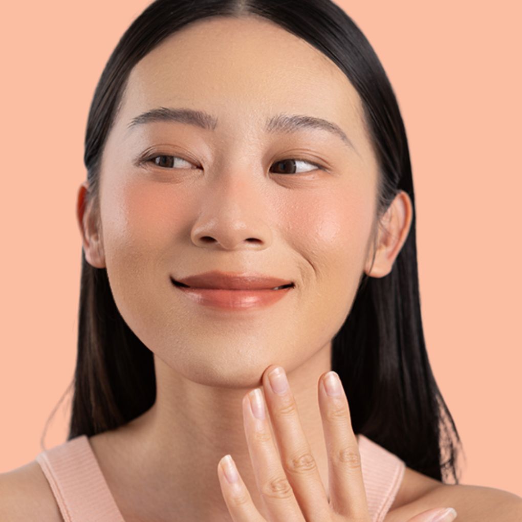 Woman wearing and showcasing the effects of the best cruelty-free Oplenza Signature Matte Lipstick in shade Graceful