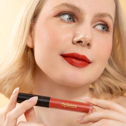 A Woman wearing and showcasing the elegant and affordable Oplenza Signature Velvet Liquid Lipstick in the color Iconic Flame