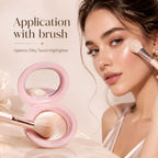 A woman applies shimmering highlighter powder from an open pink compact with a brush, with the text 'Application with brush' and 'Oplenza Silky Touch Highlighter' on a soft beige background.
Shades: Champagne, Pearl, Copper, Rose.