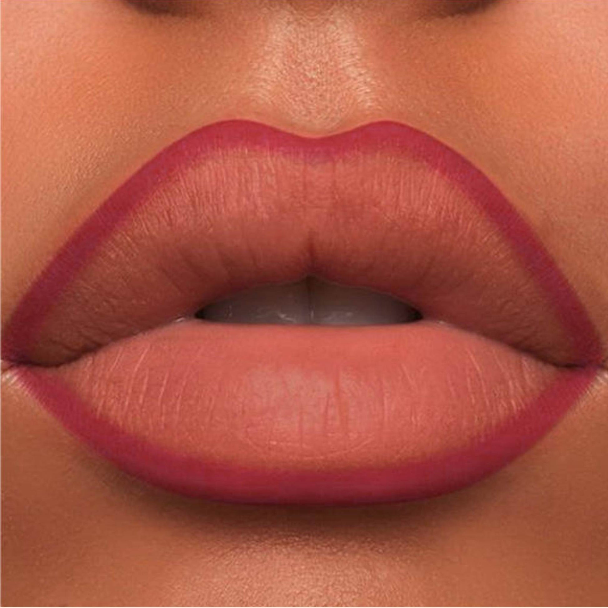 A close-up of the Oplenza Velvet Whisper Lip Liner effect on a woman's lips in the shade Flamingo Kiss
