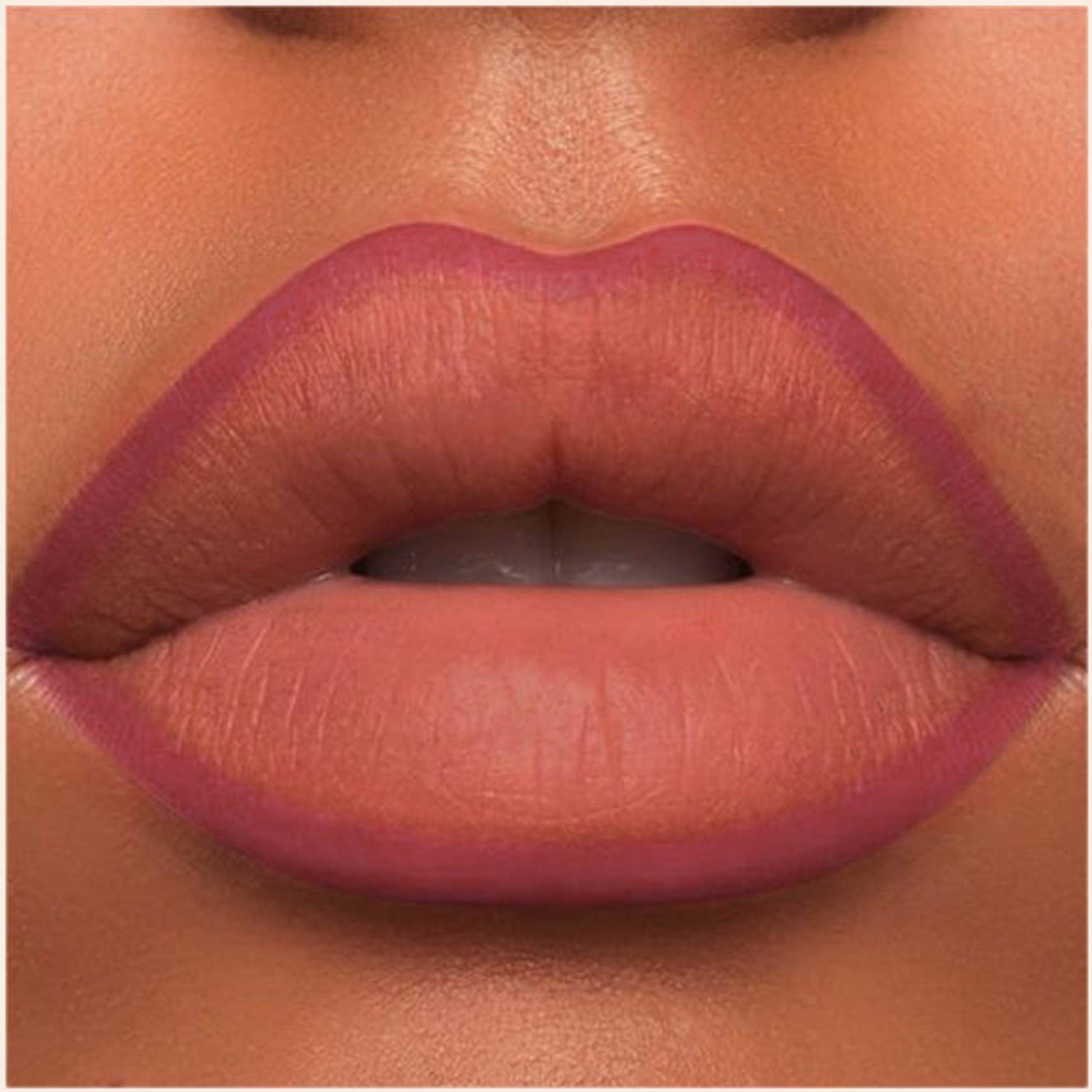 A close-up of the Oplenza Velvet Whisper Lip Liner effect on a woman's lips in the shade Rosewood Whisper