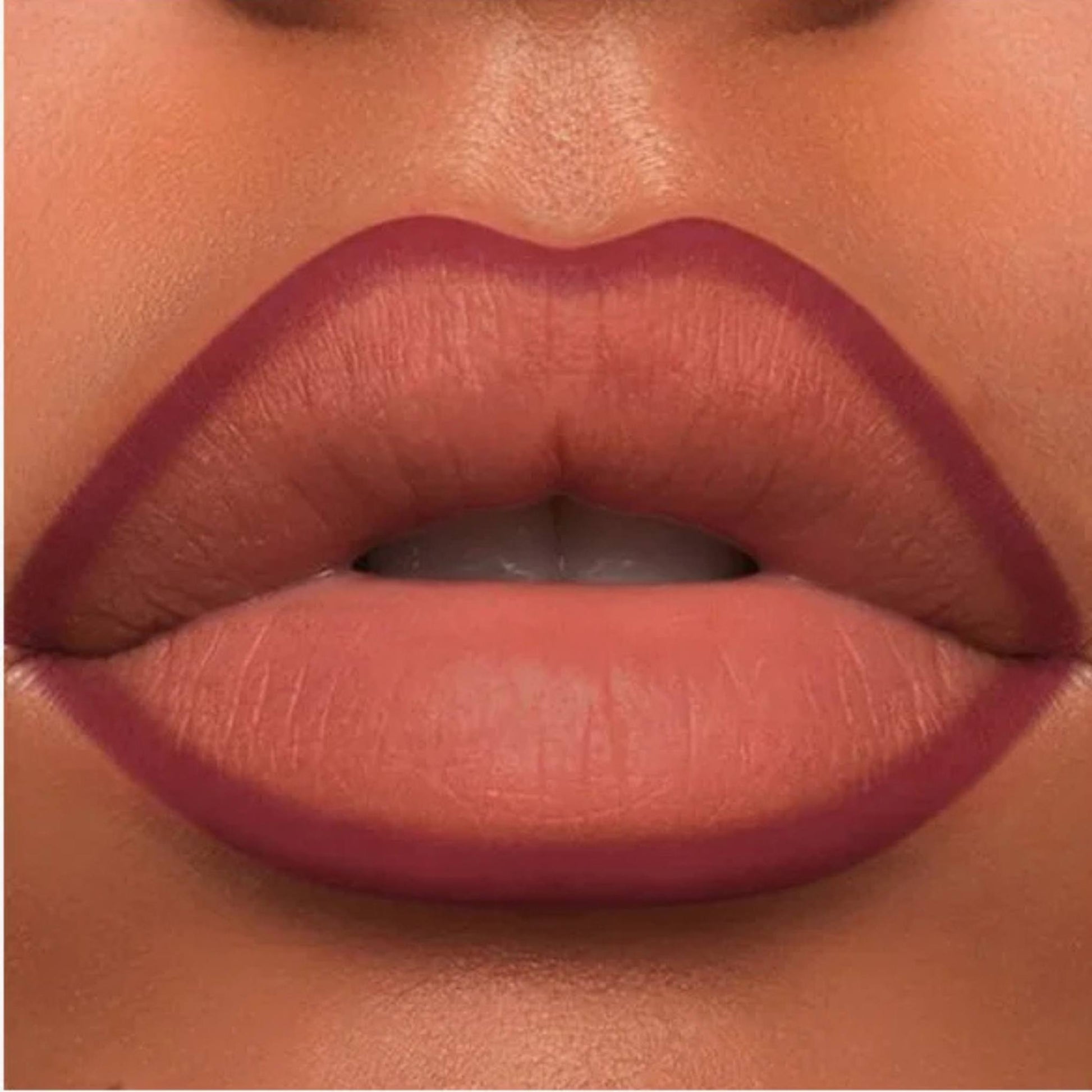 A close-up of the Oplenza Velvet Whisper Lip Liner effect on a woman's lips in the shade Scarlet Temptation