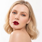Model wearing Oplenza Signature Ultra Shine Lip Gloss Dark Souls with a glossy finish.
Shades: 
01 Opaline  
02 Ballerina  
03 Elegance  
04 Sorbet  
05 Cashmere  
06 Noisette  
07 Latte  
08 Caramel  
09 Praline  
10 Cinnamon  
11 Suede  
12 Roselle  
13 Royale  
Luscious Red  
Dark Souls  
Zuri