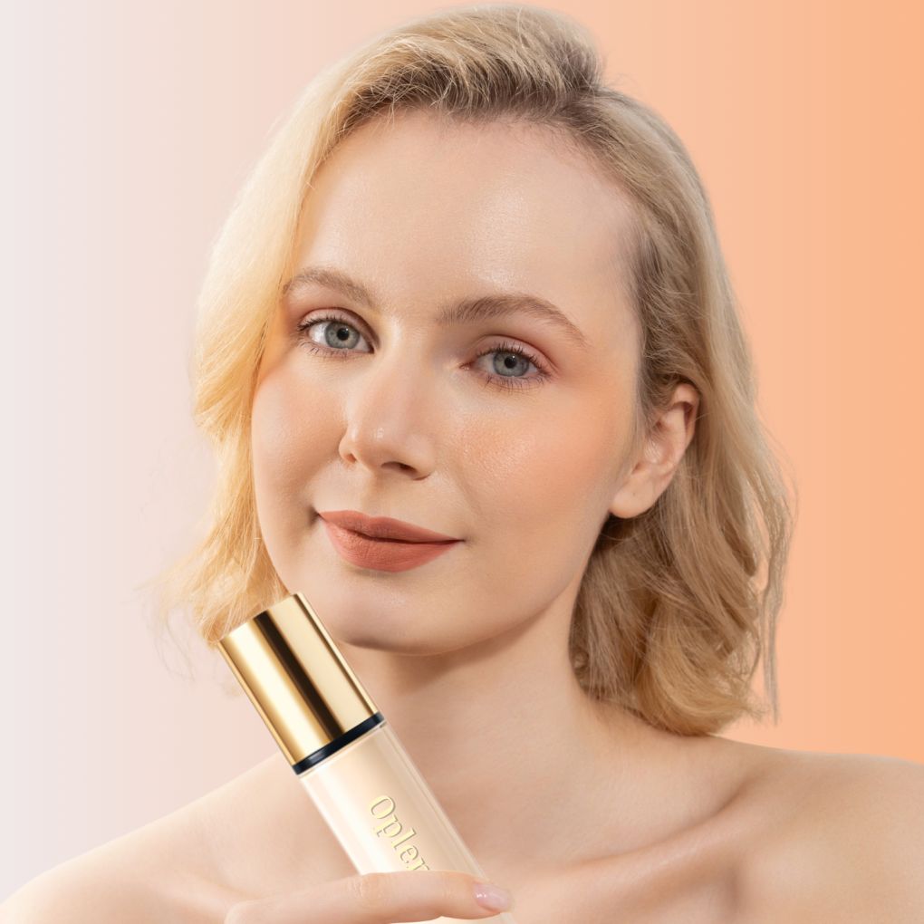 A woman showcasing Oplenza Weightless longwear liquid foundation