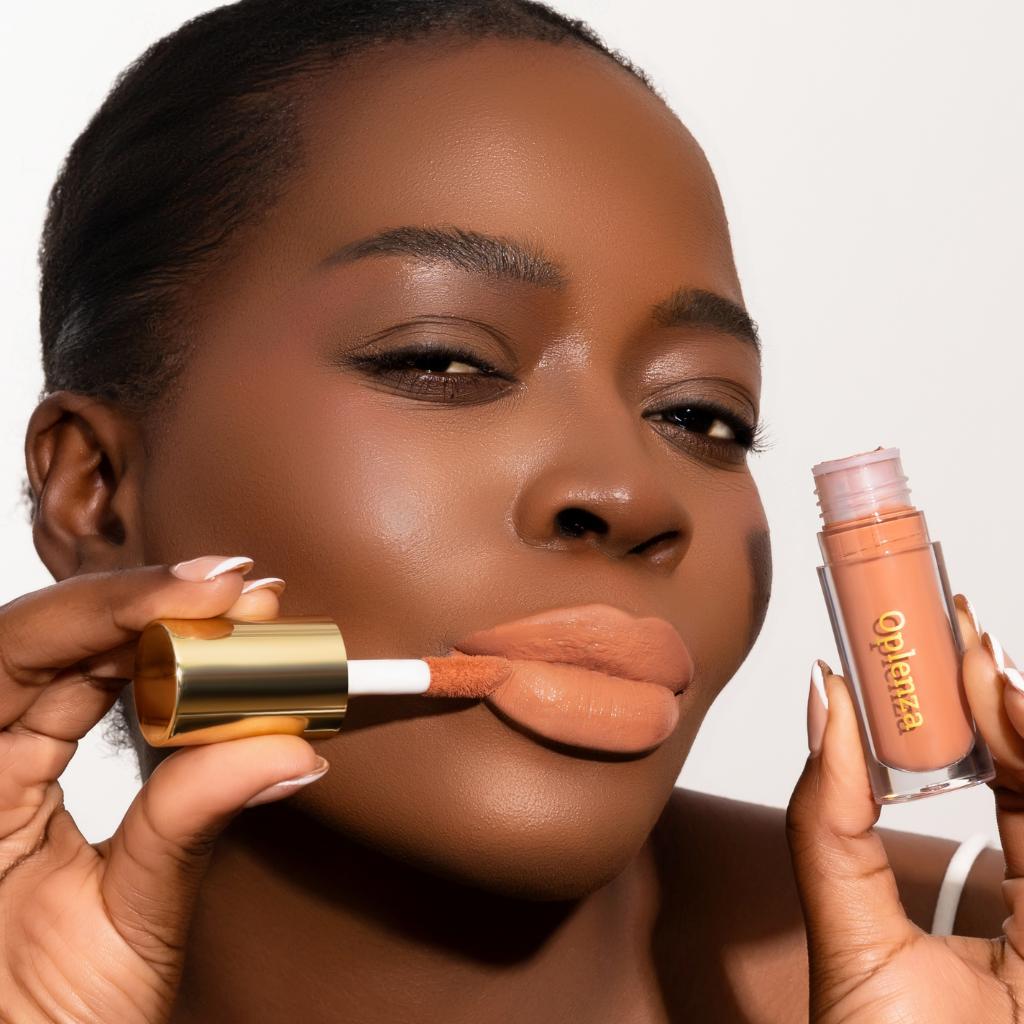 Model wearing and showcasing the vegan, cruelty-free Oplenza matte liquid lipstick in the shade Muse