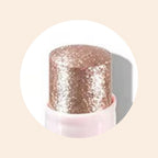 Close-up of Oplenza Crystal Jelly Glitter Stick in shade Orchid Aura-Jelly glitter highlighter on cheekbones and nose bridge