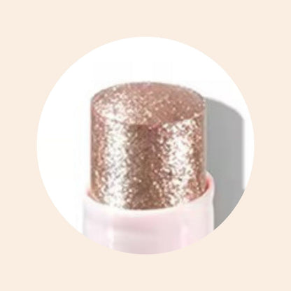 Close-up of Oplenza Crystal Jelly Glitter Stick in shade Orchid Aura-Jelly glitter highlighter on cheekbones and nose bridge