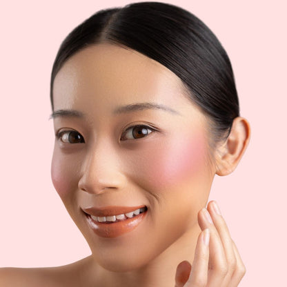 Woman wearing and showcasing the effect of oplenza Velvet Whip cream blush in shade Petal Milk