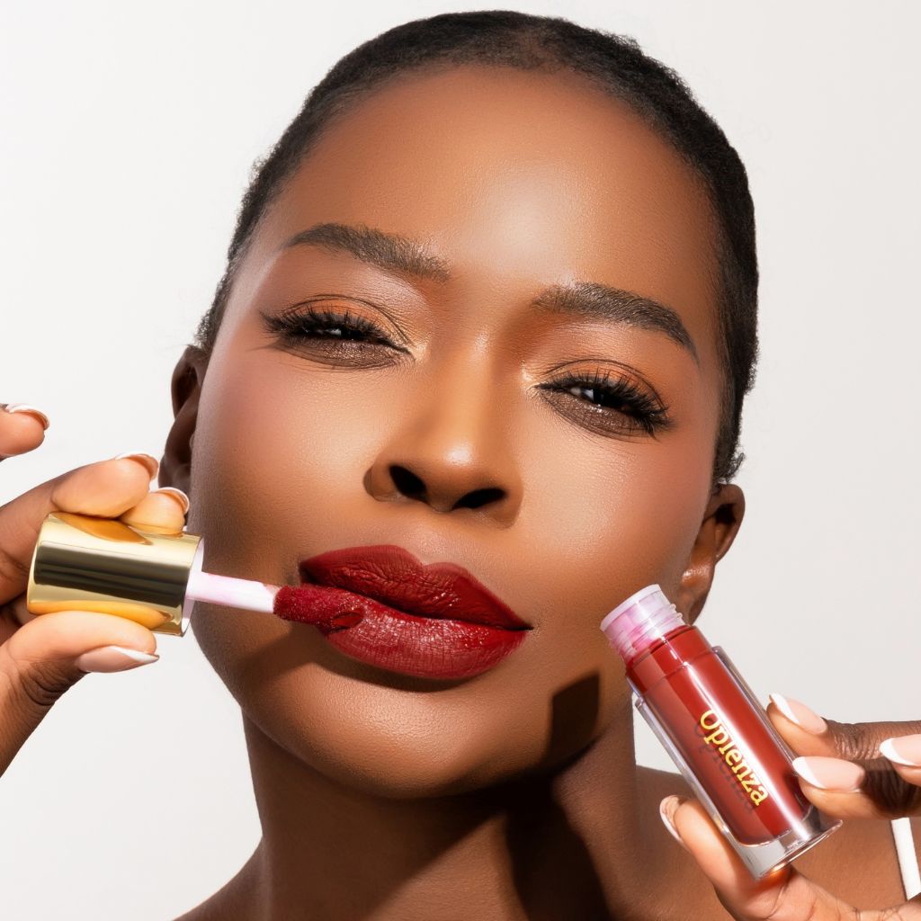 Model wearing and showcasing the vegan, cruelty-free Oplenza matte liquid lipstick in the shade Power