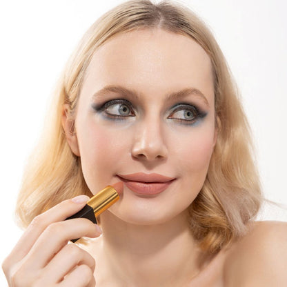 Woman applying and showcasing the effects of the best cruelty-free Oplenza Signature Matte Lipstick in Shade Radiant