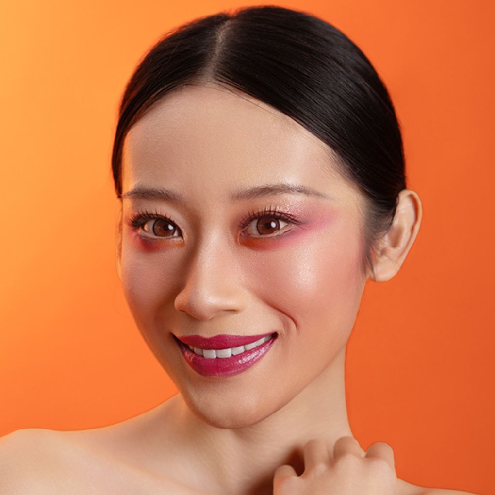 Woman showcasing oplenza eyeshadow palette effect, radiant, colorful in shade Radiant Ritual