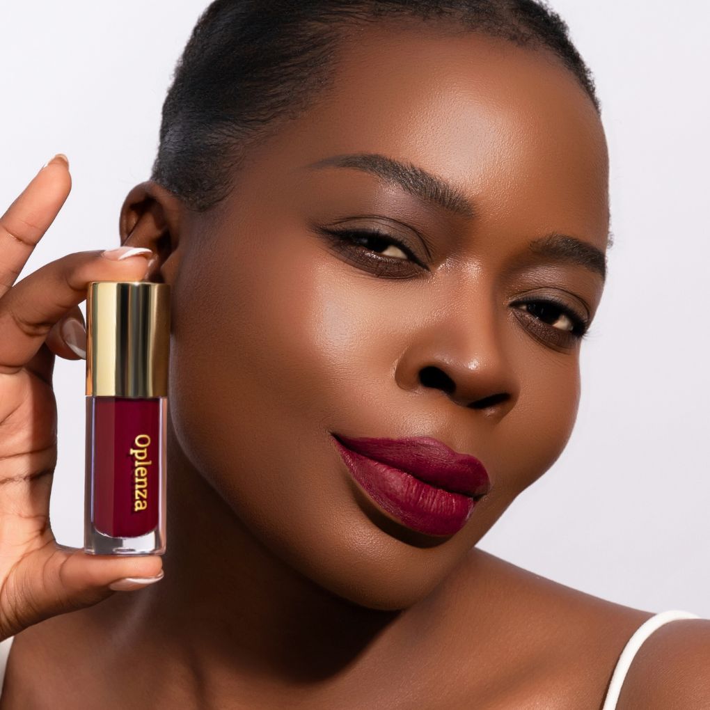 Model wearing and showcasing the vegan, cruelty-free Oplenza matte liquid lipstick in the shade Reign