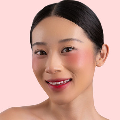 Woman wearing and showcasing the effect of oplenza Velvet Whip cream blush in shade Rosy Glacé