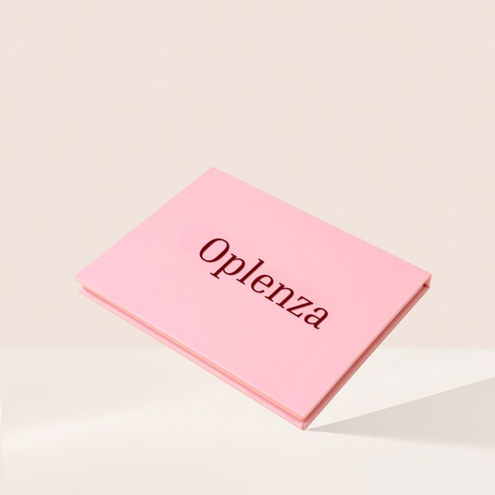 Oplenza Signature Shades Palette-eyeshadow palette on a beige background-Solara Flare, Radiant Ritual, Soft Seduction, Aurora Rush, Ocean Tide