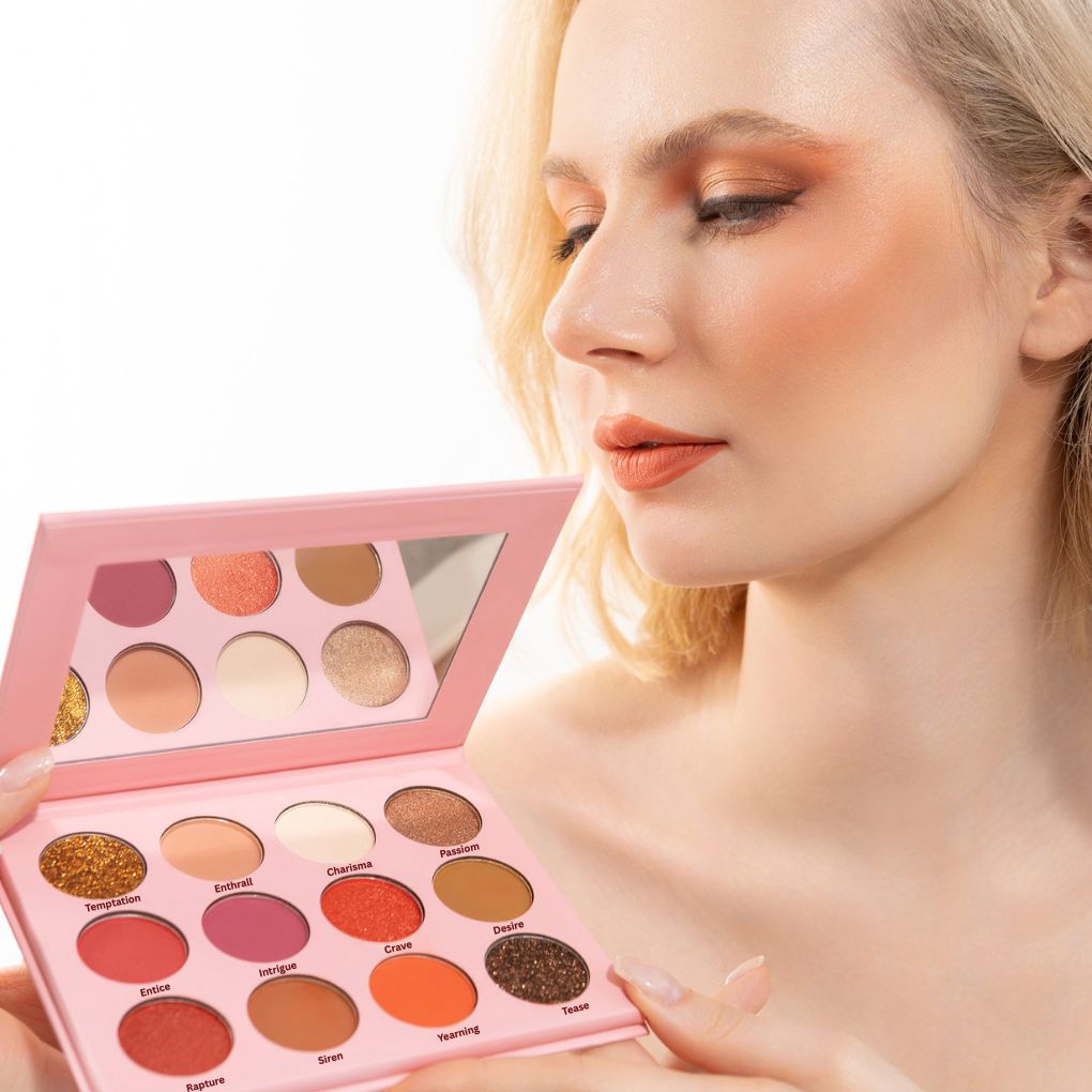 Woman holding and showcasing oplenza radiant vegan eyeshadow palette effects on her face-shade Soft Seduction