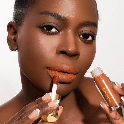 Model wearing and showcasing the vegan, cruelty-free Oplenza matte liquid lipstick in the shade Terra