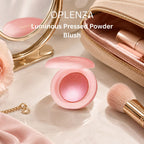Opleenza Luminous Pressed Powder Blush in a round pink compact, styled on a marble surface with a makeup bag, brush, mirror, and rose.
Shades: Baby, Girl, Mood, Pretty, Passion.