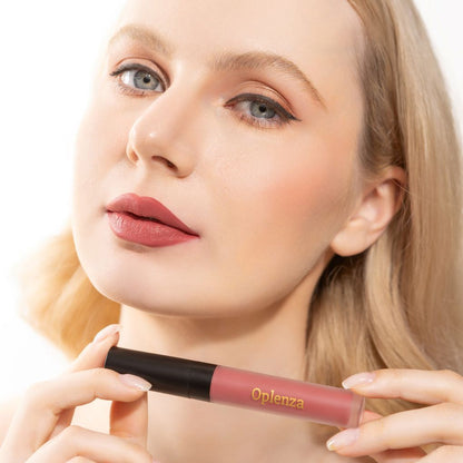 A Woman wearing and showcasing the elegant Oplenza Signature Velvet Liquid Lipstick in the color Velour Blush