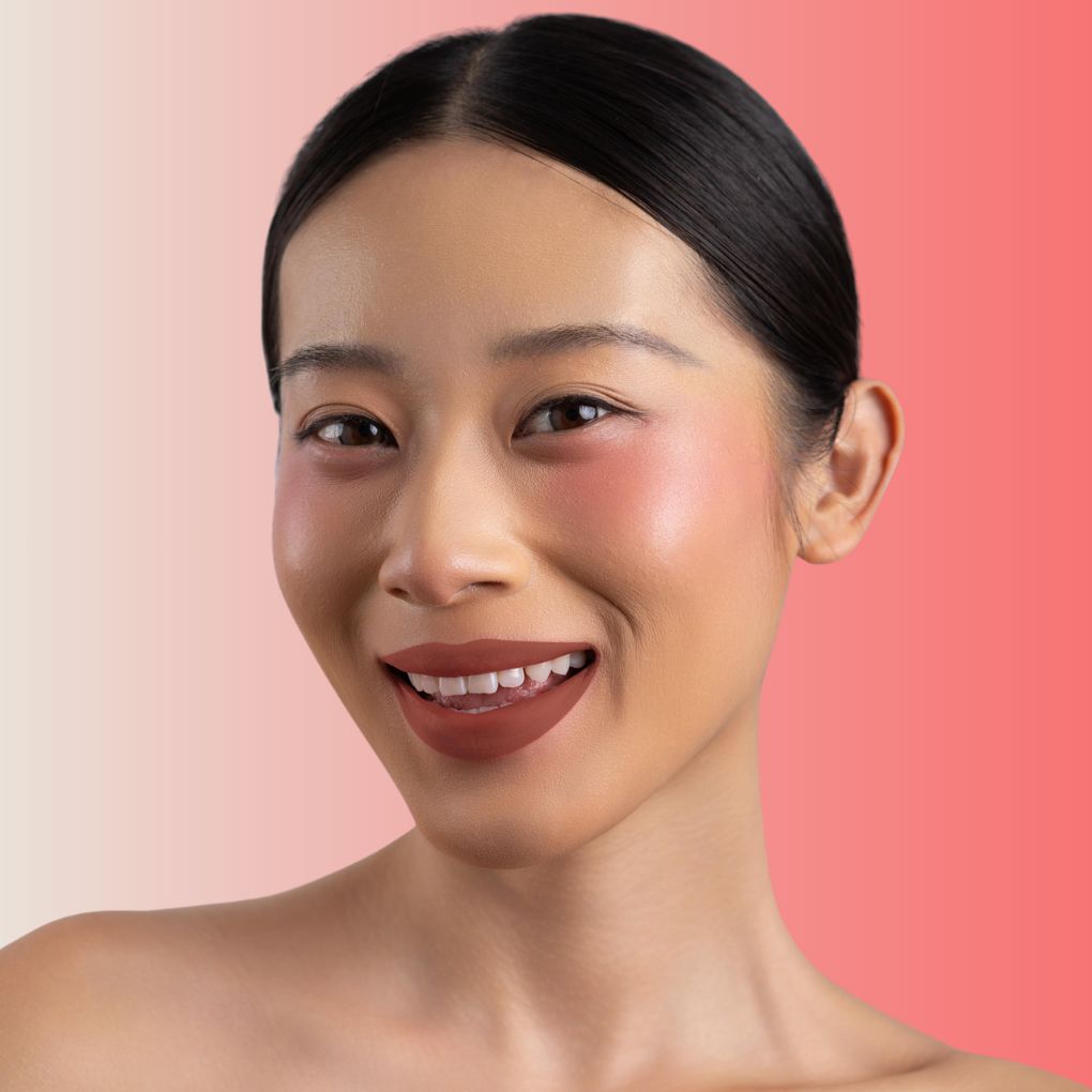 An elegant woman wearing and showcasing the vegan, luxury and cruelty free oplenza Define & Refine Lip Liner in the color 05 Warm Mocha