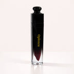 Oplenza Signature Ultra Shine Lip Gloss in Zuri, showing the tube on a neutral background, best vegan tinted lip gloss