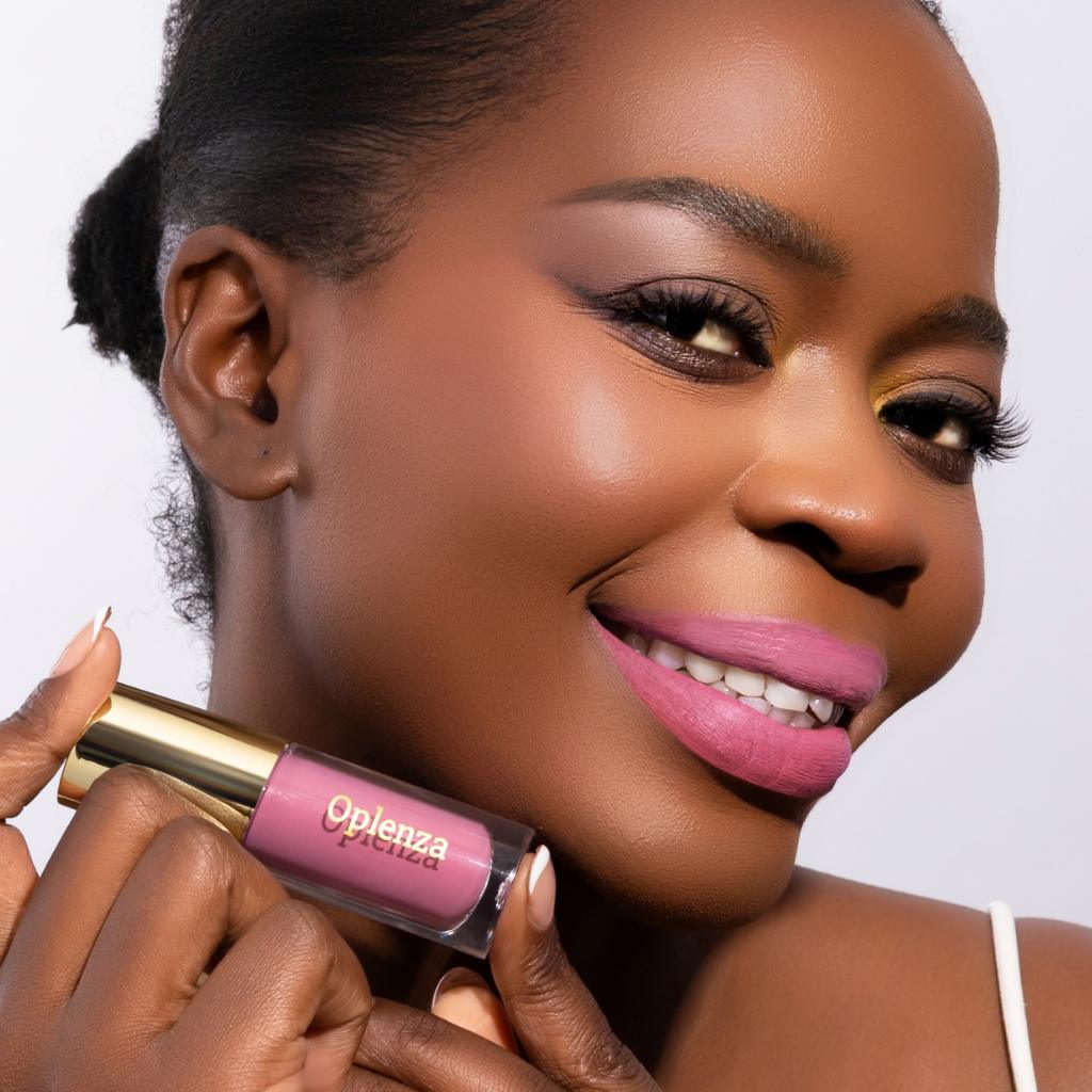 Model wearing and showcasing the vegan, cruelty-free Oplenza matte liquid lipstick in the shade Serene